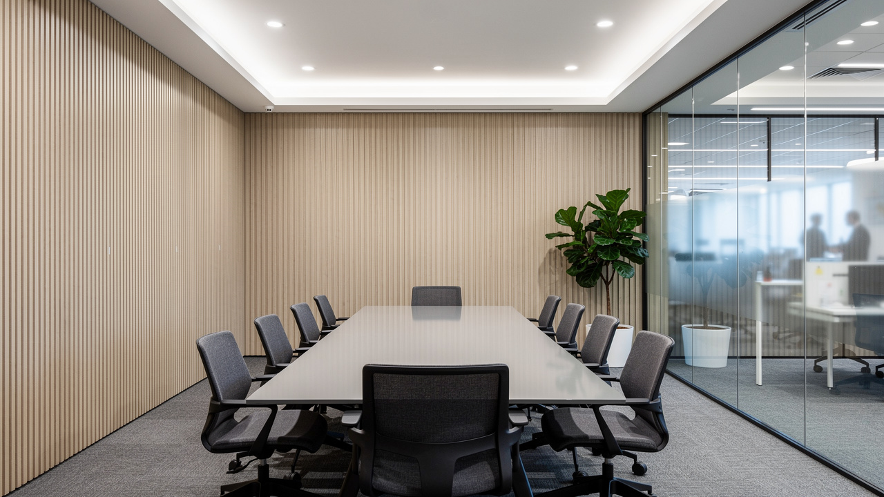 Corporate meeting room walls lined with acoustic groove panels