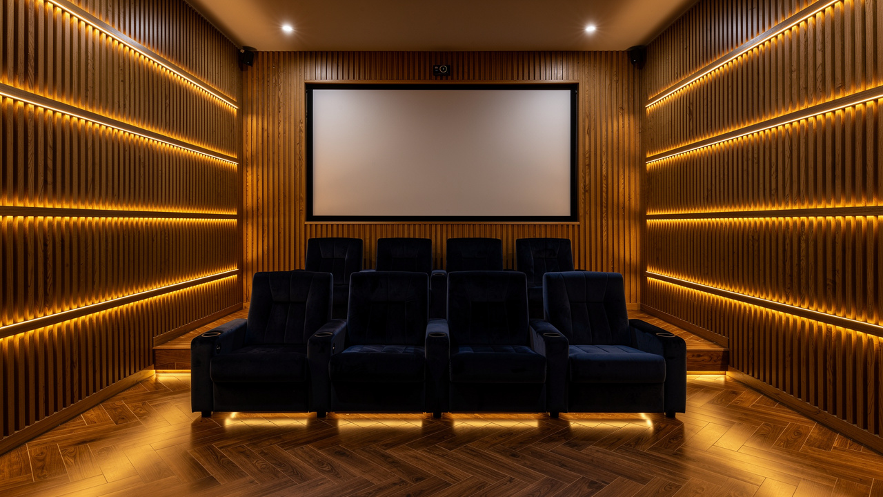 Slatted acoustic wood panels in a residential home cinema room