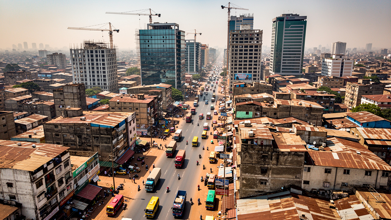Aerial view of dense African city with heavy traffic noise