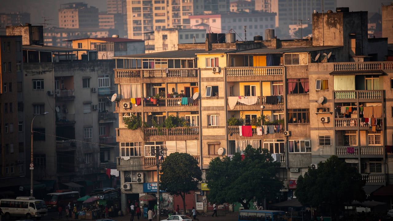 High-rise apartment buildings in African urban cityscape at golden hour