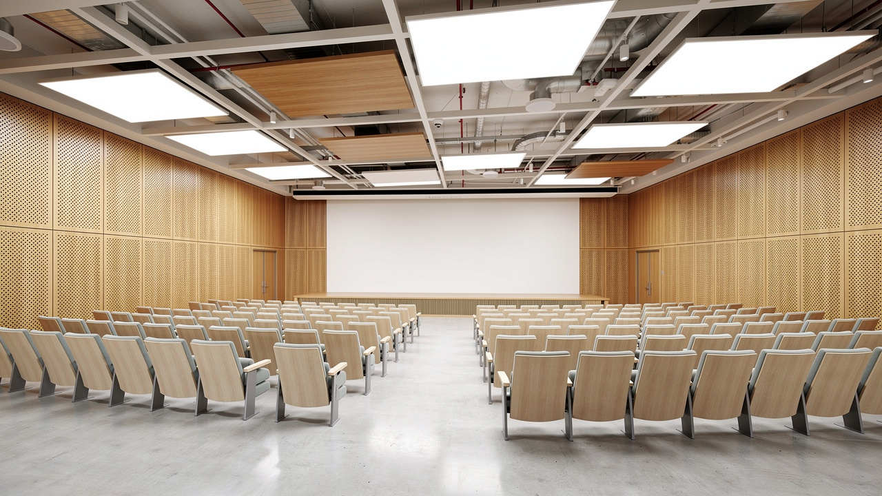 University lecture theater with perforated wooden acoustic wall panels